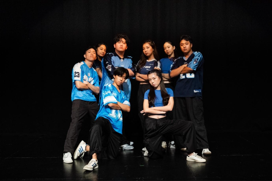 A group of people posing for a photo Description automatically generated (1)